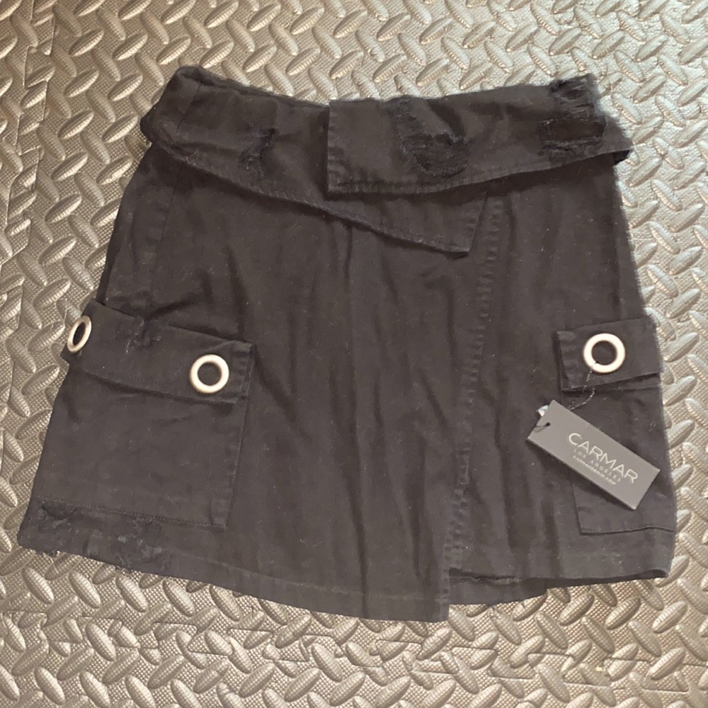 Carmar. NWT. Black denim skirt. Size 12. Soft denim with fashionable rips.